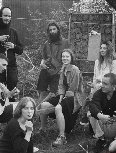 Mastering The 13 Female Personality Archetypes: The Ultimate Blueprint For Advanced Seduction 64 Charming Woman Laughing Among Friends At A Social Gathering, Representing The Outgoing And Lively Nature Of The Social Butterfly Archetype.