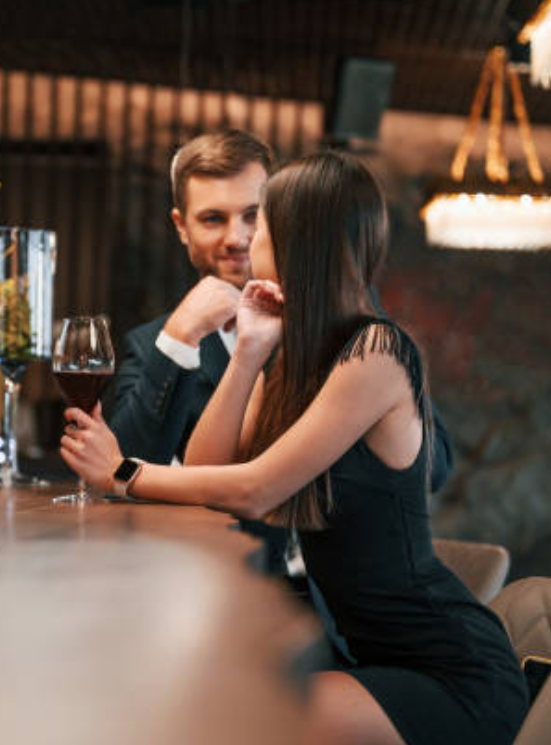 Pattern Interrupt: The Key To Creating Sexual Tension 37 A Confident Man And An Elegant Woman Engaging In A Deep Conversation At A Bar, Demonstrating The Power Of Pattern Interrupt In Building Attraction And Intrigue