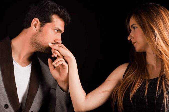 How To Seduce A Married Woman: A Masterclass In Emotional Connection And Influence 64 A Man Gently Kissing A Woman'S Hand While Gazing Into Her Eyes, Illustrating The Use Of Speed Seduction Tactics To Create A Connection