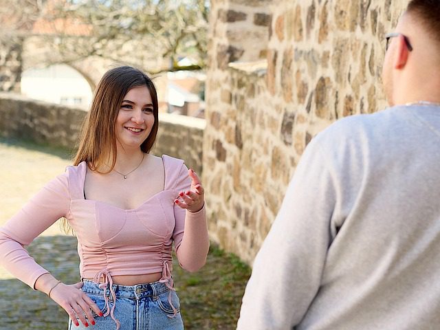 How To Seduce A Married Woman: A Masterclass In Emotional Connection And Influence 62 A Woman Smiling And Engaging In A Lighthearted Conversation, Demonstrating The Art Of Subtle Flirting Through Body Language And Genuine Interest.