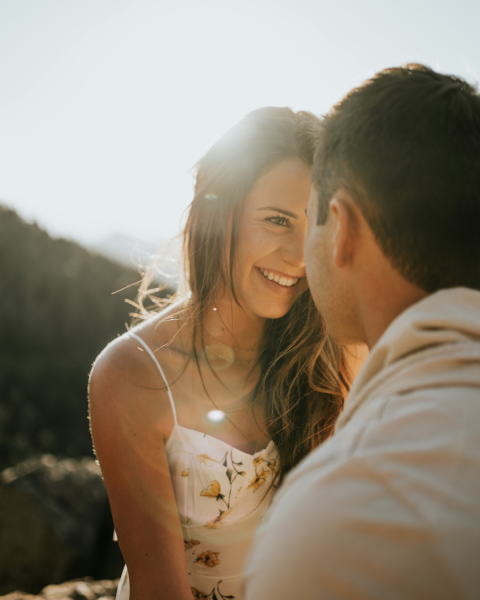 How To Build Sexual Tension With A Woman On A Date 48 A Couple Locked In Deep Eye Contact, Smiling Under The Sunset, Naturally Building Sexual Tension Through Body Language And Emotional Connection