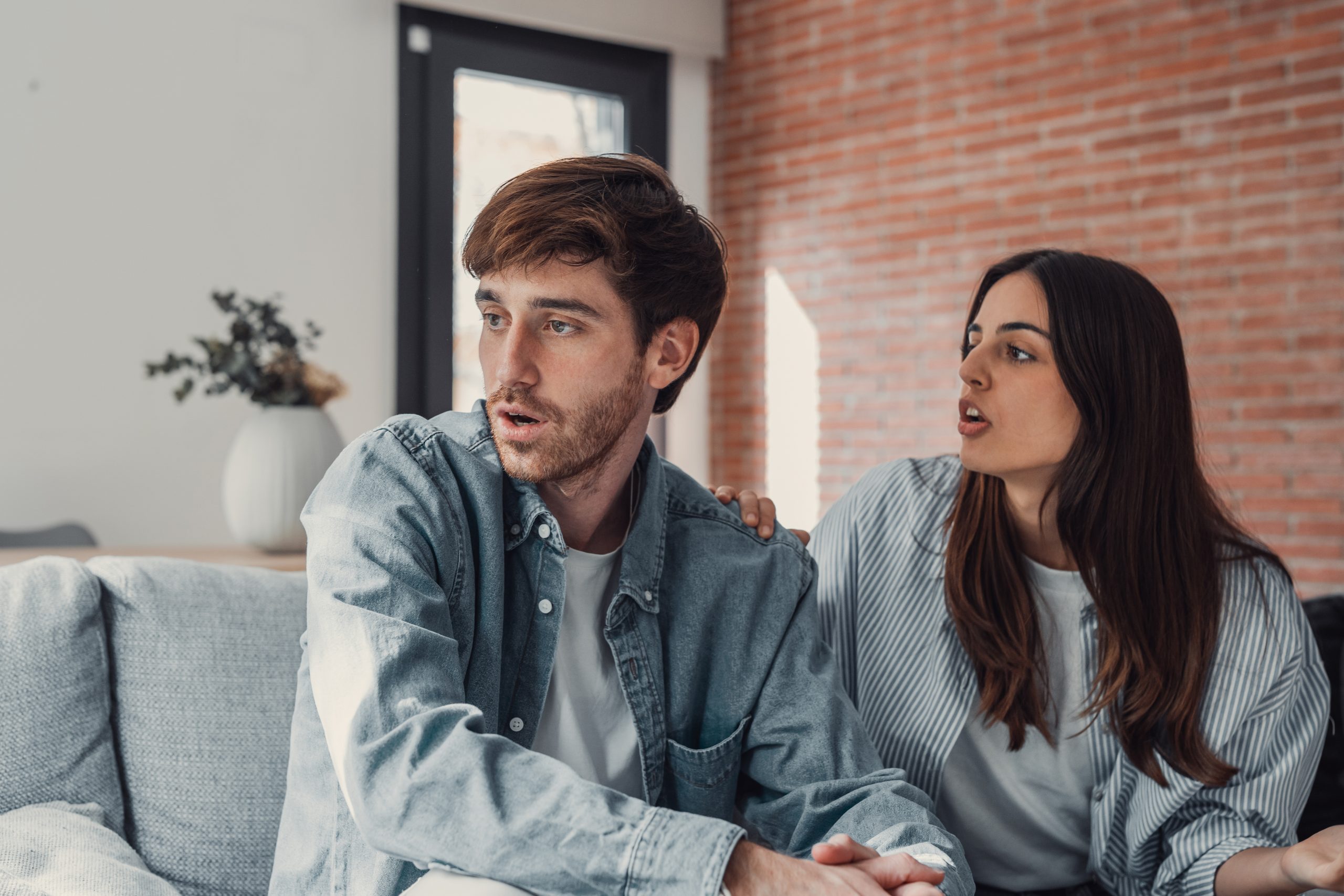 Why Your Girlfriend Starts Drama Out Of Nowhere - And How To Stay Calm And In Control 19 Why Your Girlfriend Starts Drama Out Of Nowhere - Beautiful Lady Is Depressed, Sitting On The Couch Talking To Man, Having A Dispute With Husband Or Boyfriend, Looking Desperate And Hopeless, Having Unresolved Problem Or Question