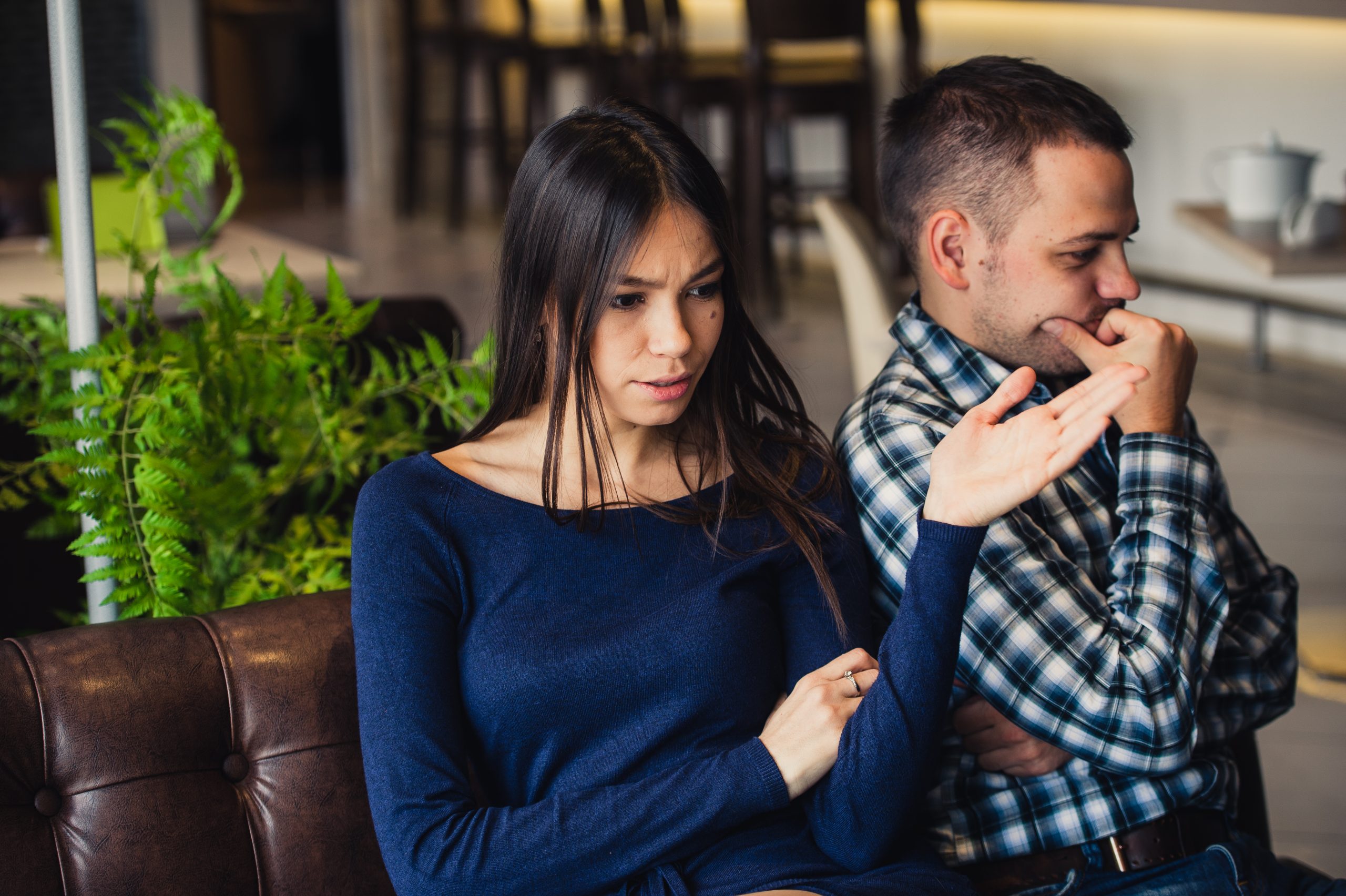 Why Your Girlfriend Starts Drama Out Of Nowhere - And How To Stay Calm And In Control 21 Why Your Girlfriend Starts Drama Out Of Nowhere - Couple Sitting At Cafe During Lunch. They Are Taking Offense And Sitting Back To Back.