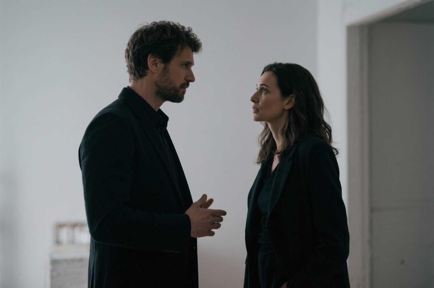 What Women Say Vs. What They Actually Mean — The Translation Guide Every Man Needs 36 Cinematic Composition Of Man And Woman In Conversation, Subdued Lighting, Tension And Curiosity Visible, Subtle Emotional Charge, Editorial Realism.