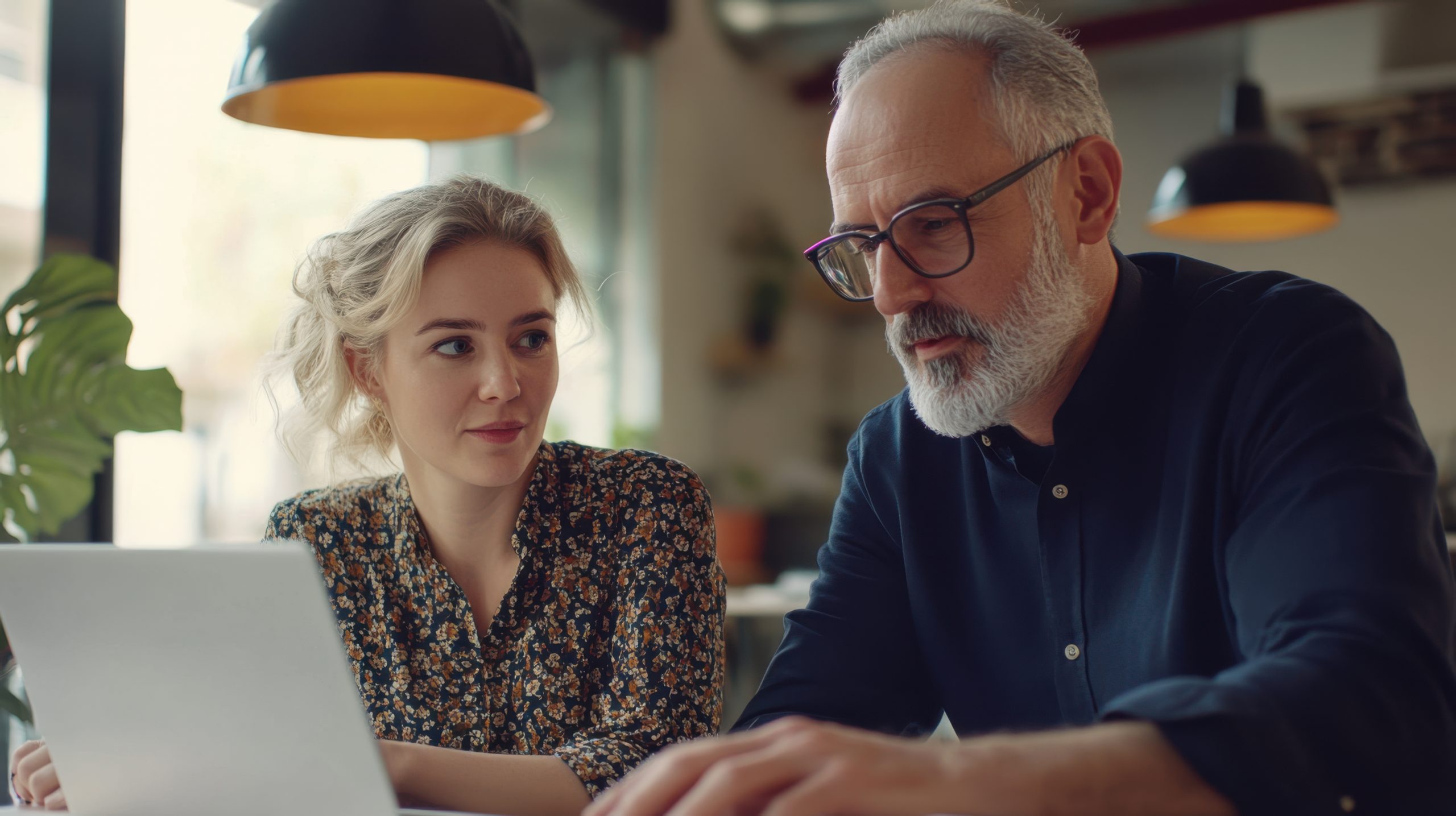 Dating A Younger Woman At Work: How To Navigate A Workplace Affair 34 Dating A Younger Woman At Work: Professional European Woman And Mature Mentor Man Collaborating On A Project