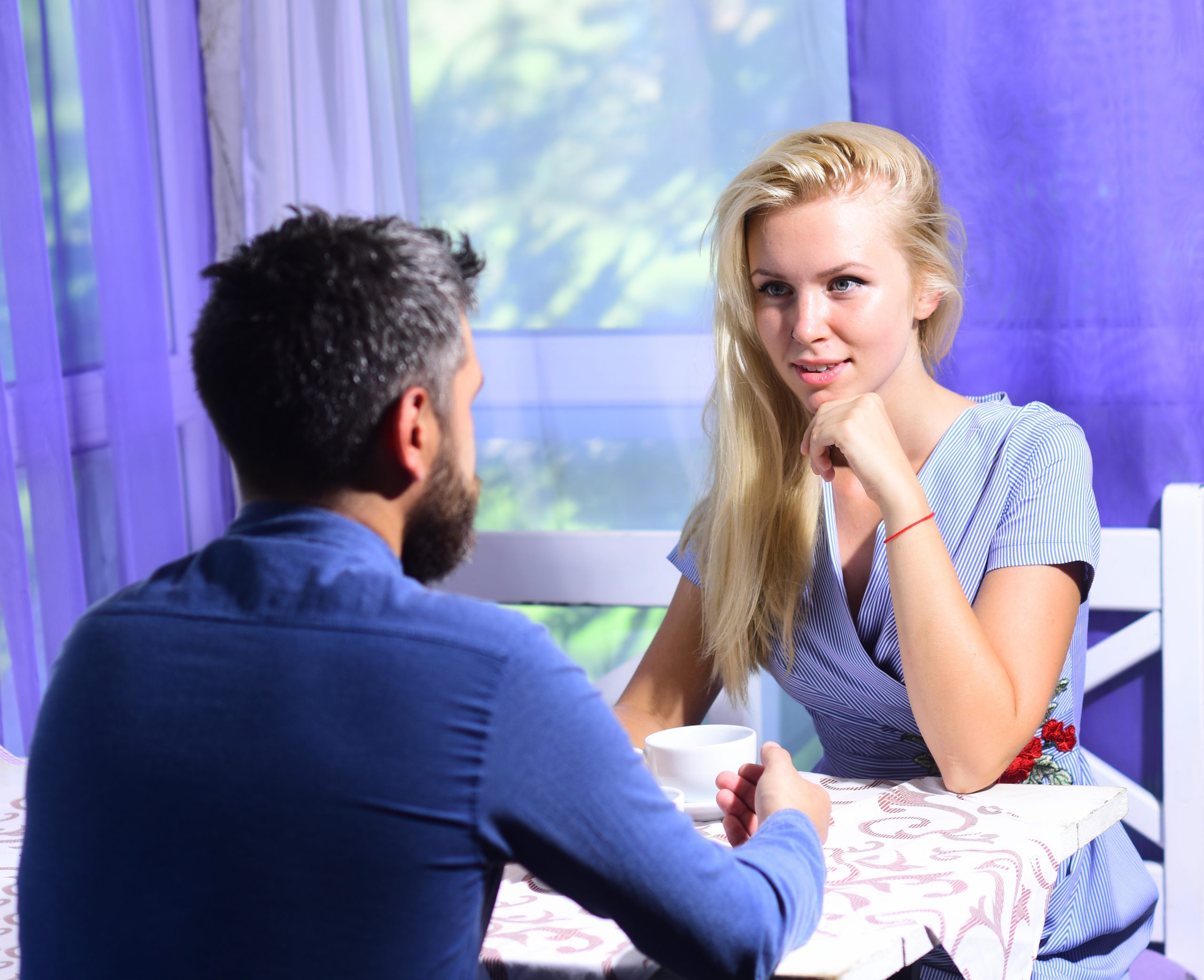 How To Tell If A Girl Is Playing With Your Emotions (Clear Signs &Amp; Solutions) 25 How To Tell If A Girl Is Playing With Your Emotions - Woman And Flirty Face And Man Have An Affair. Girl With Blond Hair And Bearded Guy On Light Cafe Background. Lunch Time And Communication Concept. Couple In Love Holds Cups Of Coffee At Table