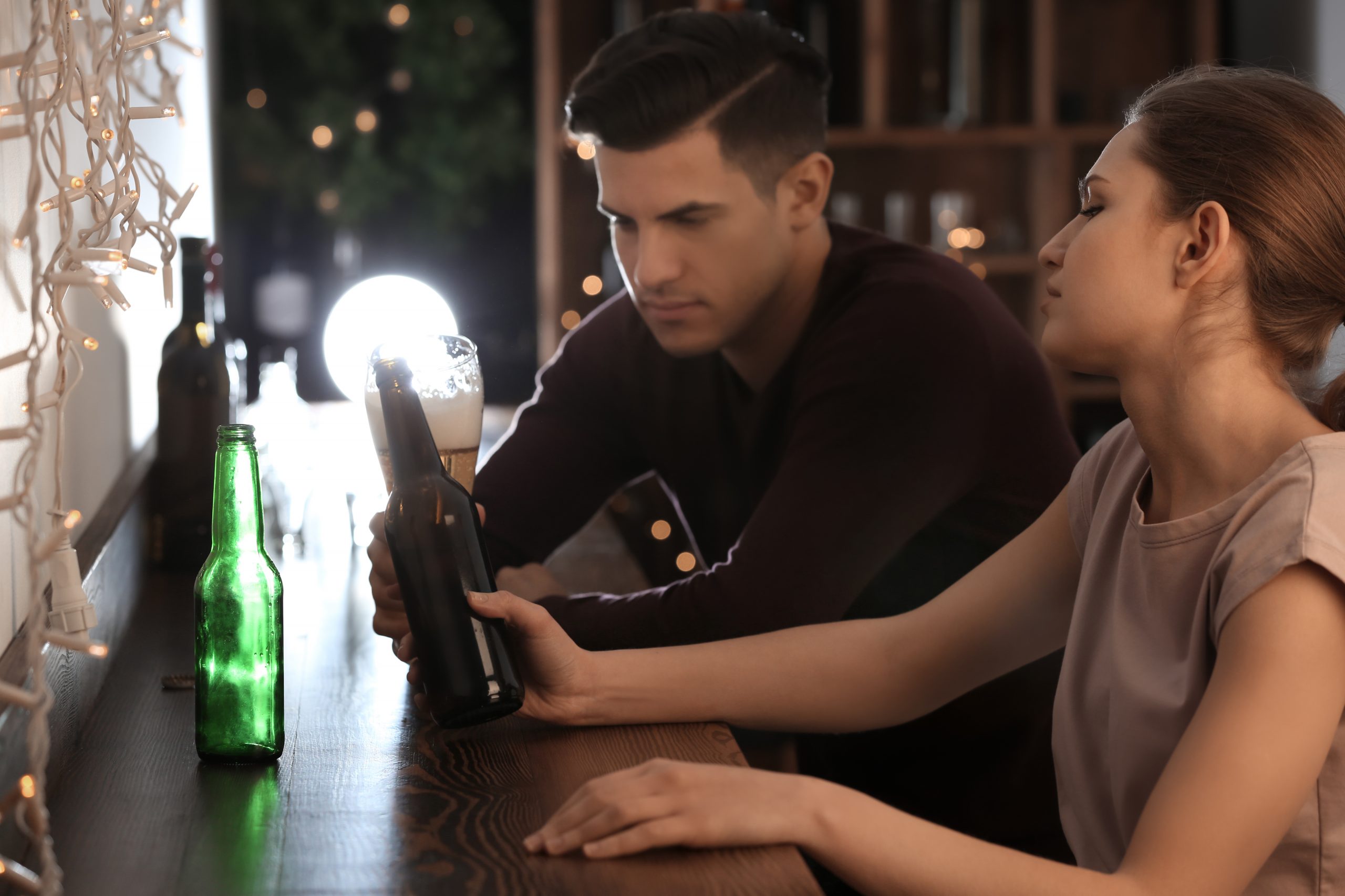 Why Ignoring A Woman Works (And Why It’s Dangerously Addictive) 23 Why Ignoring A Woman Works - Young Couple Drinking In Bar. Alcoholism Problem
