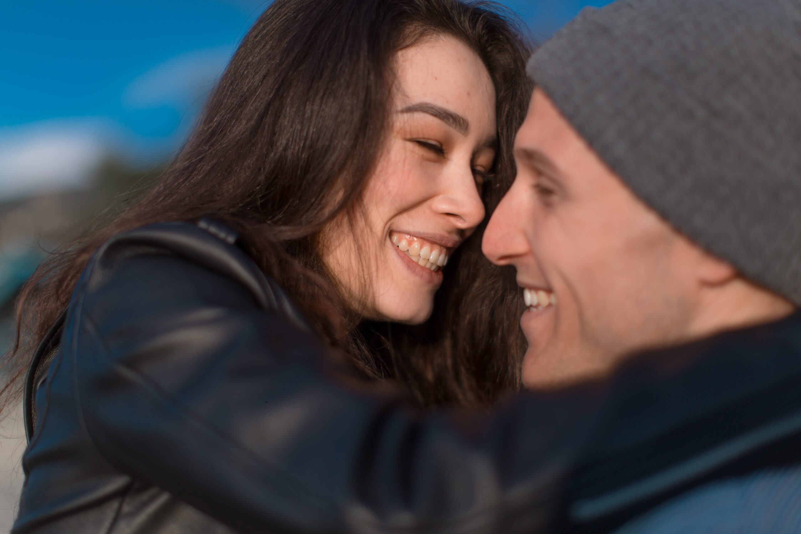 How To Make Your Girlfriend Happy Using The “Contrast” Mind Trick 14 A Couple Of Lovers Laugh And Hug On The Embankment. Love, Youth, Happiness Concept.