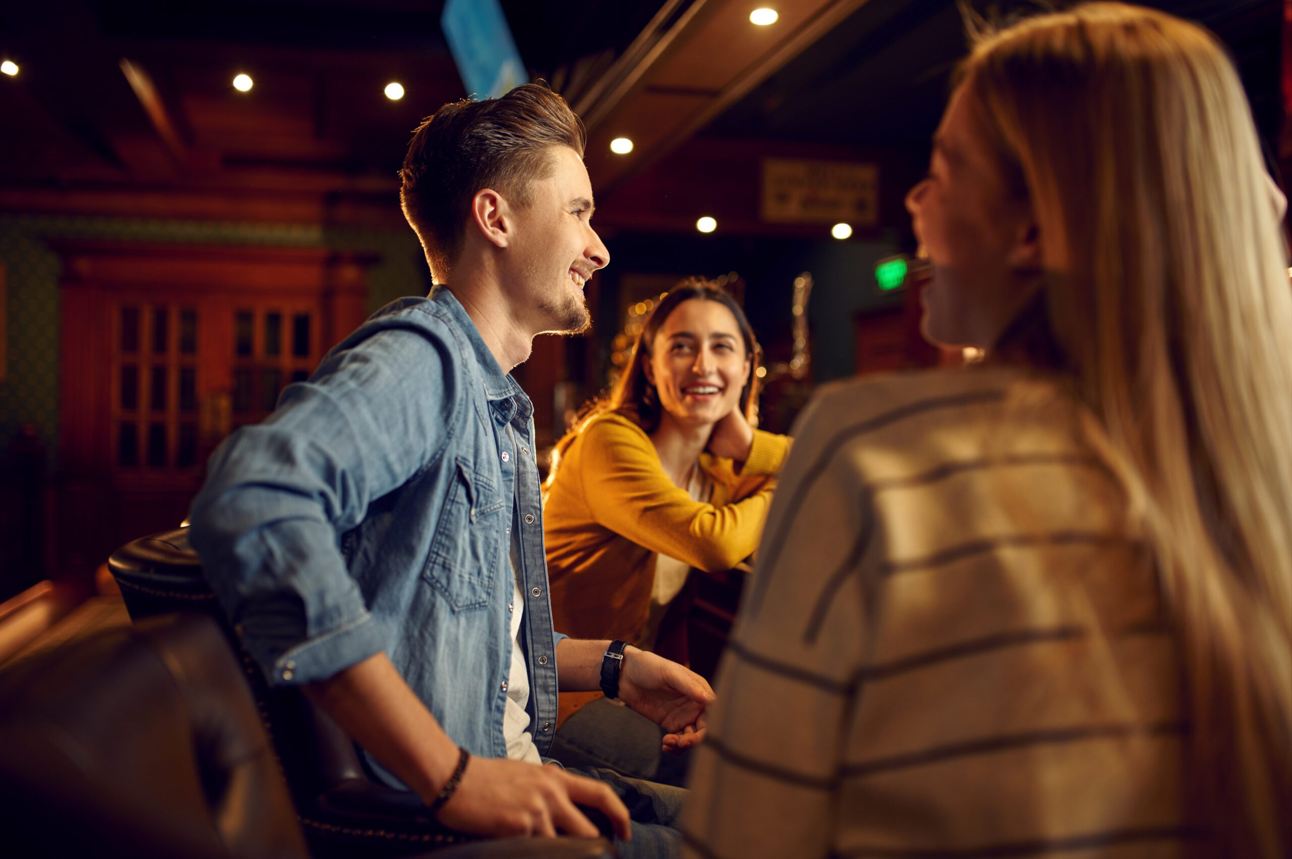 Can’t Get Women No Matter What You Do? Here'S The Brutal Truth (And What To Fix) 36 Smiling Friends Leisures At The Counter In Bar. Group Of People Relax In Pub, Night Lifestyle, Friendship, Event Celebration